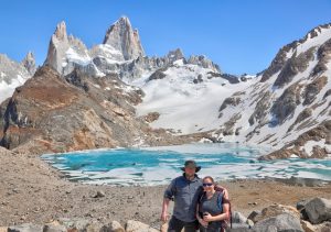 Base of Fitzroy and lake with hikers and ice, Chalten, Argentina