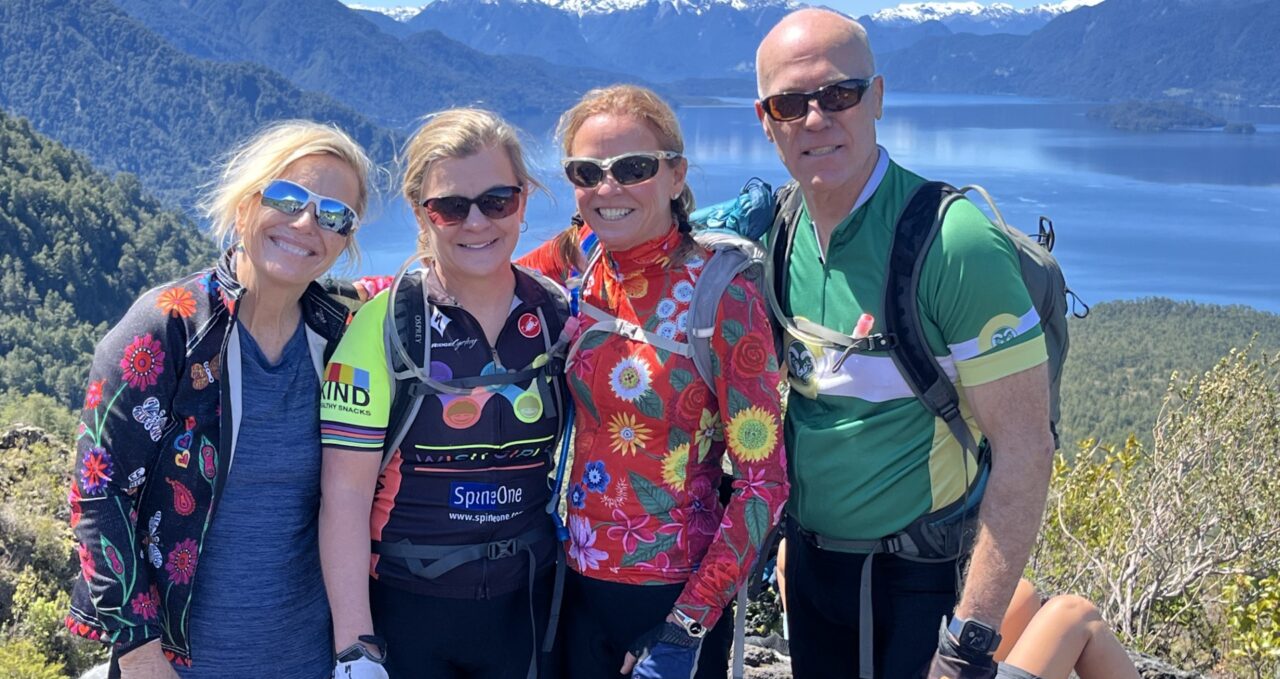 4 people in bright cycle jackets