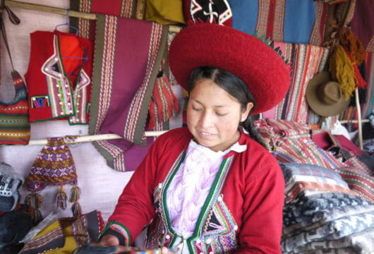 Weaver in traditional dress, Peru